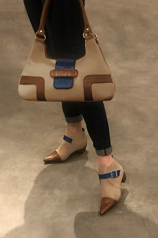 Caramel brown, tan beige and denim blue women's ankle boots with buckles at the front. Tapered toe. Low cone heels. Worn view - Florence KOOIJMAN